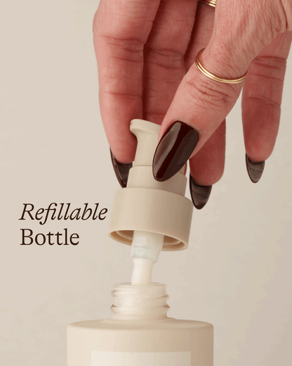 Hand removing pump from Dezi Skin Claro Que C Vitamin C Glow Serum refillable bottle