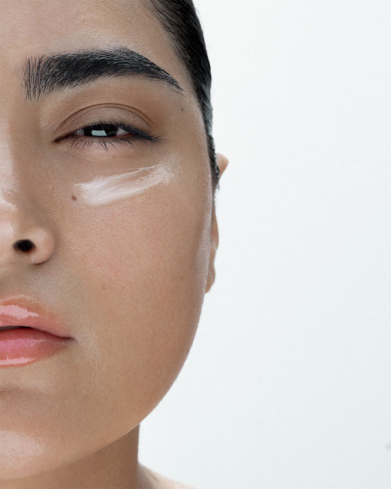 overnight mask formula on a models face. you can see it under her eyes. the mask is perfect for brining hydration to the under eye area